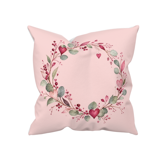 Rosa Dekokissen Herzkranz 40x40 mit Aquarellkranz, roten Herzen und grünen Blättern – Kissenglück